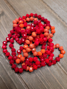 MULTI RED TONE BEADED NECKLACE